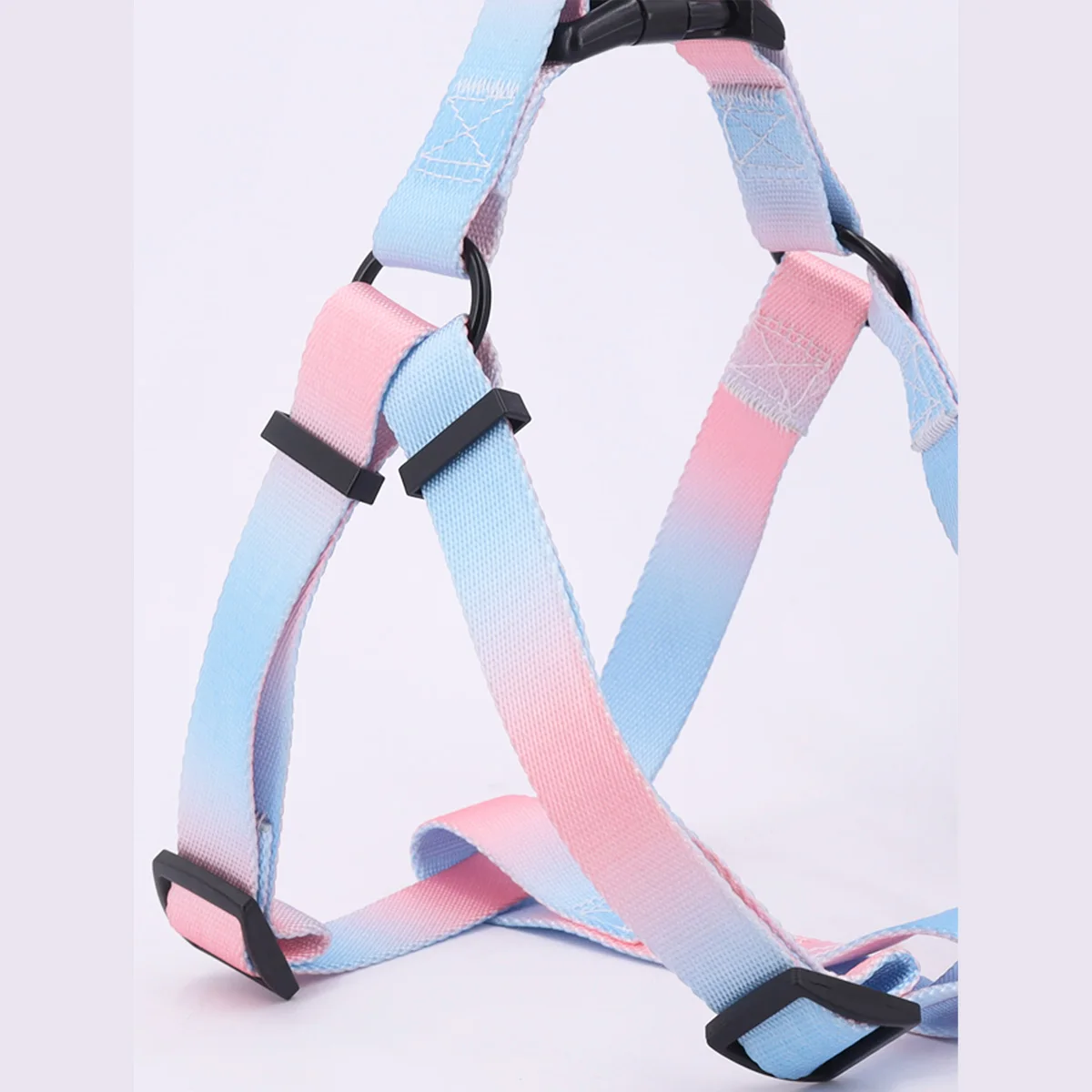 A set of colorful pet harness with leash and dog leash for indoor and outdoor use